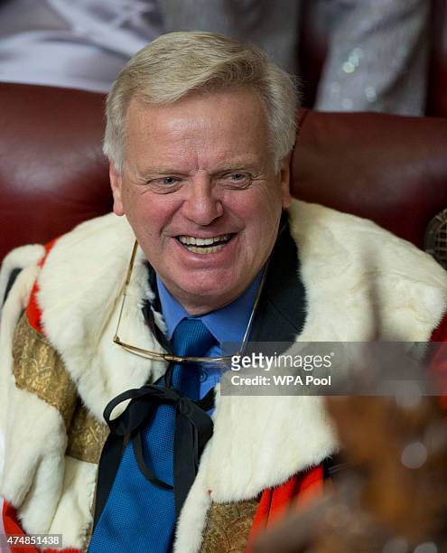 Lord Michael Grade smiles as he waits for Queen Elizabeth II to deliver her speech to the House of Lords in the Palace of Westminster, during the...