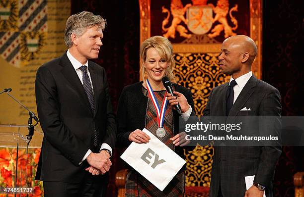 Marianne Timmer holds her Emerging Coach Award during the Dutch Winter Olympic Medal winners ceremony held at the Ridderzaal on February 25, 2014 in...