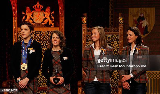 Skaters Jorien Ter Mors, Ireen Wurts, Lotte van Beek and Marrit Leenstra pose with their Ridder in de Orde van Oranje-Nassau or Knight in the Order...