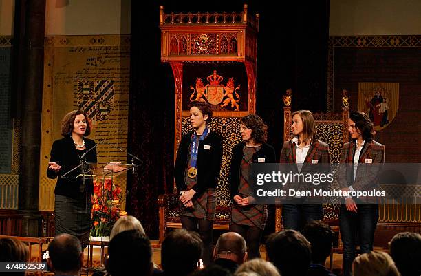 Netherlands Sport Minister, Edith Schippers speaks to skaters Jorien Ter Mors, Ireen Wurts, Lotte van Beek and Marrit Leenstra as they pose with...