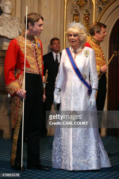 Britain's Camilla, Duchess of Cornwall exchanges words with Lord Great Chamberlain David Cholmondeley, Marquess of Cholmondeley, as she leaves during...