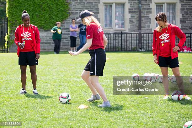 Robyn Gale and Selenia Iacchelli of team Canada's women's soccer team watched a special olympic athlete dribble a ball on May 26, 2015. Diana...