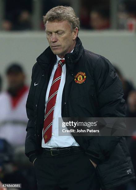 Manager David Moyes of Manchester United watches from the touchline during the UEFA Champions League Round of 16 match between Olympiacos FC and...