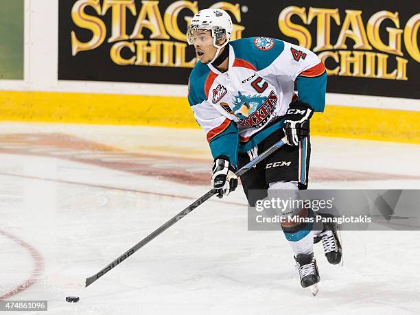 Madison Bowey of the Kelowna Rockets moves the puck in Game One during the 2015 Memorial Cup against the Quebec Remparts at the Pepsi Coliseum on May...