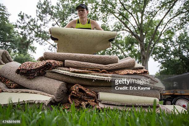 Cliff Watkins cleans up his parents house following the massive flooding, May 27, 2015 in Houston, Texas. Watkins, who grew up in the house, said...