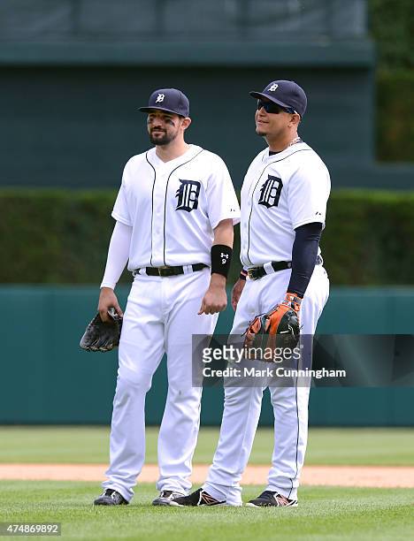 Nick Castellanos and Miguel Cabrera of the Detroit Tigers stand together on the field during the game against the Houston Astros at Comerica Park on...