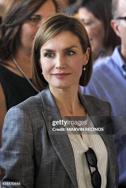 Spain's Queen Letizia visits a market in Suchitoto, 47 km east of San Salvador, on May 27, 2015. Queen Letizia visits El Salvador to supervise...