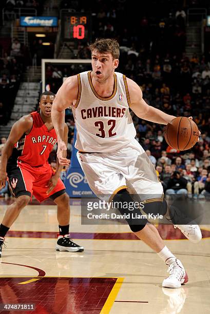 Spencer Hawes of the Cleveland Cavaliers drives to the hoop against the Toronto Raptors at The Quicken Loans Arena on February 25, 2014 in Cleveland,...