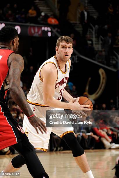 Spencer Hawes of the Cleveland Cavaliers controls the ball in the game against the Toronto Raptors at The Quicken Loans Arena on February 25, 2014 in...