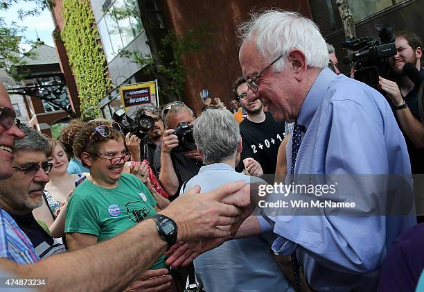 Democratic presidential candidate and U.S. Sen. Bernie Sanders greets an overflow crowd after a campaign event at the New England College May 27,...