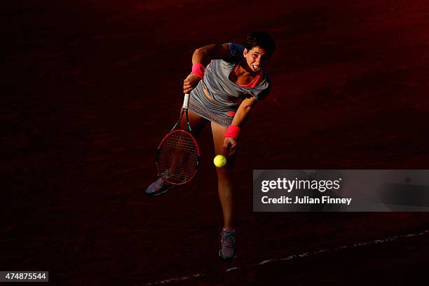 Carla Suarez Navarro of Spain serves during her women's singles match against Virginie Razzano of France during day four of the 2015 French Open at...