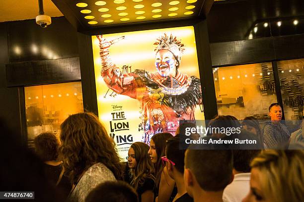 People wait in line to see the matinee show of The Lion King on May 27, 2015 in New York City. The Broadway season broke records with 13.1 million...