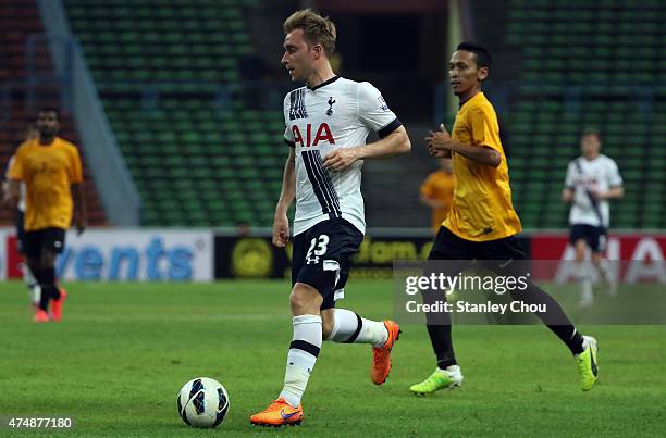 Christian Eriksen of Tottenham Hotspur runs with the ball during the pre-season friendly match between Malaysia XI and Tottenham Hotspur at Shah Alam...