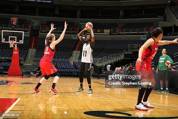 Amber Harris of the Minnesota Lynx handles the ball against the Washington Mystics during an Analytic Scrimmage at the Verizon Center on May 26, 2015...