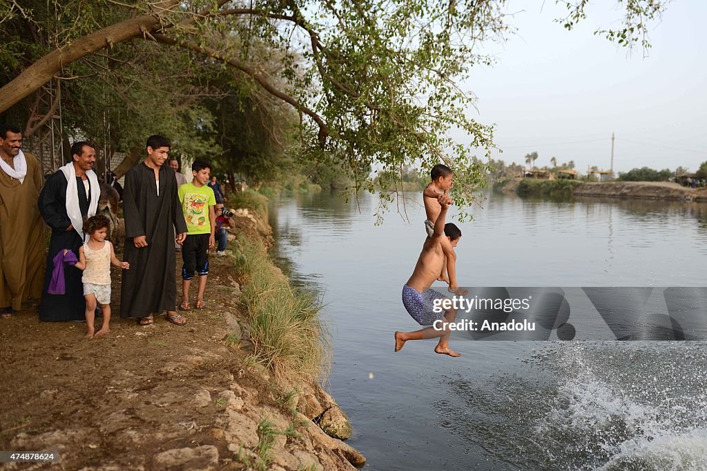 Egyptians enjoy Nile river in Minya