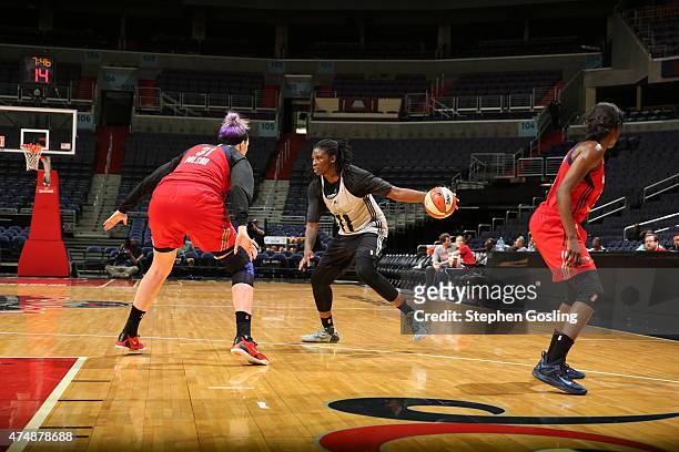 Amber Harris of the Minnesota Lynx handles the ball against the Washington Mystics during an Analytic Scrimmage at the Verizon Center on May 26, 2015...