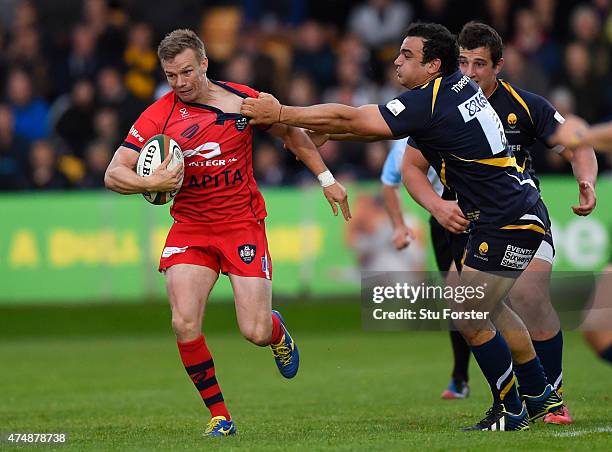 Bristol player Dwayne Peel is tackled by Aagustin Creevy during the Greene King IPA Championship final second leg match between Worcester Warriors...