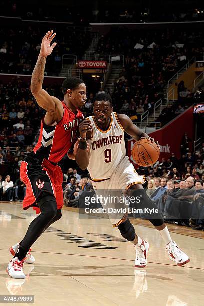 Luol Deng of the Cleveland Cavaliers drives to the hoop against DeMar DeRozan of the Toronto Raptors at The Quicken Loans Arena on February 25, 2014...