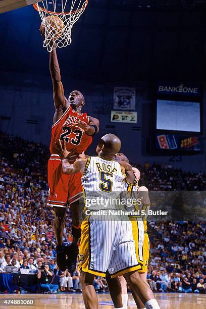 Michael Jordan of the Chicago Bulls shoots the ball against Jalen Rose of the Indiana Pacers in 1998 at Market Square Arena in Indianapolis, Indiana....