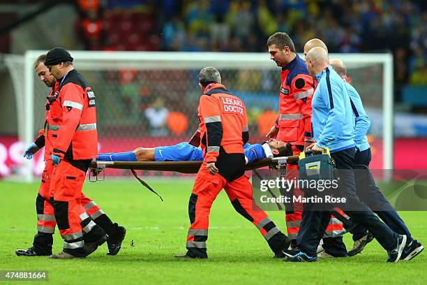 Matheus of Dnipro leaves the field on a stretcher during the UEFA Europa League Final match between FC Dnipro Dnipropetrovsk and FC Sevilla on May...