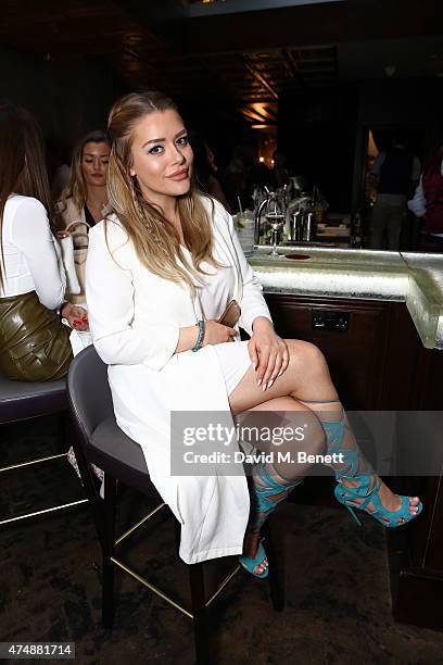 Amy Christophers attends the launch of Look Of The Day Fashion at Library on May 27, 2015 in London, England.