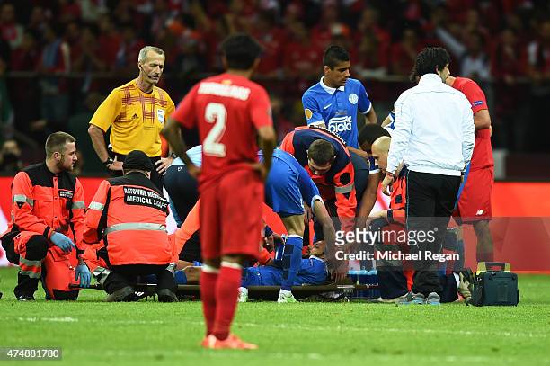 Matheus of Dnipro leaves the field on a stretcher during the UEFA Europa League Final match between FC Dnipro Dnipropetrovsk and FC Sevilla on May...