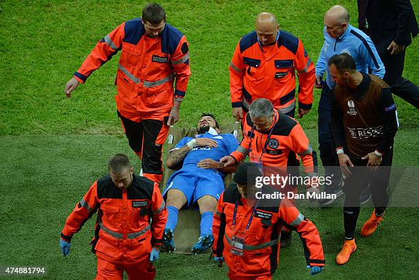 Matheus of Dnipro leaves the field on a stretcher during the UEFA Europa League Final match between FC Dnipro Dnipropetrovsk and FC Sevilla on May...