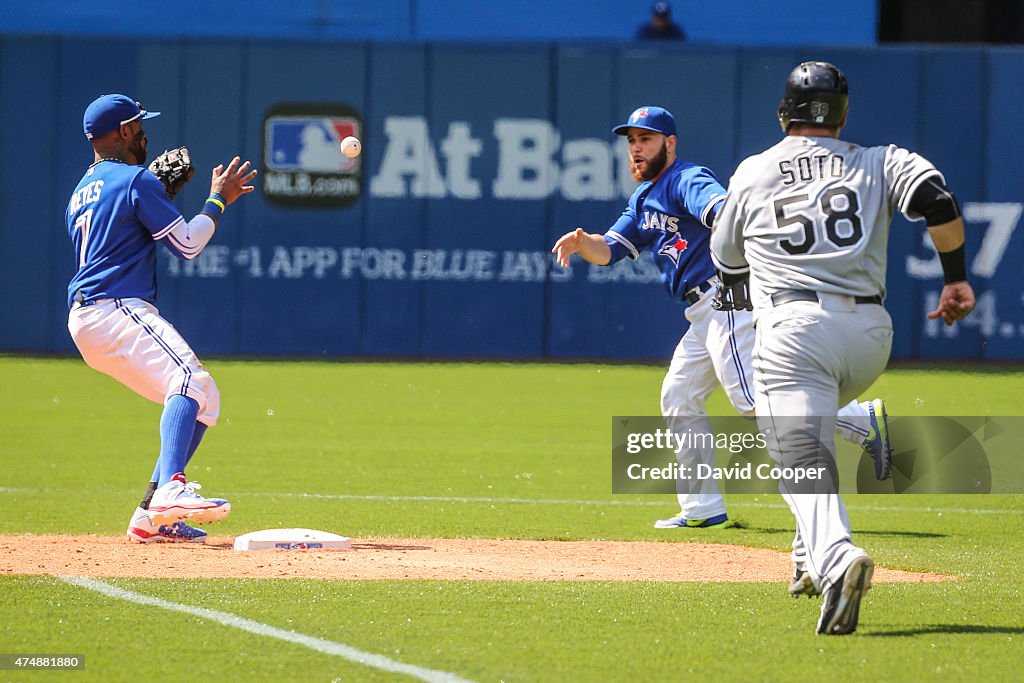 Russell Martin (55) of the Toronto Blue Jays playing 2nd Base in the top of the 9th fields a ground ball and feeds Jose Reyes (7) in time to get Geovany Soto (58) of the Chicago White Sox