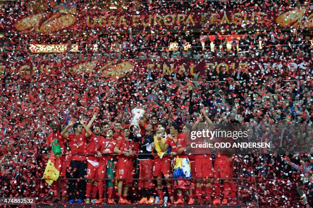 Sevilla players celebrate with trophy after the UEFA Europa League final football match between FC Dnipro Dnipropetrovsk and Sevilla FC at the...