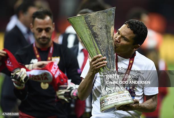 Sevilla's Colombian forward Carlos Bacca celebrate with trophy after the UEFA Europa League final football match between FC Dnipro Dnipropetrovsk and...