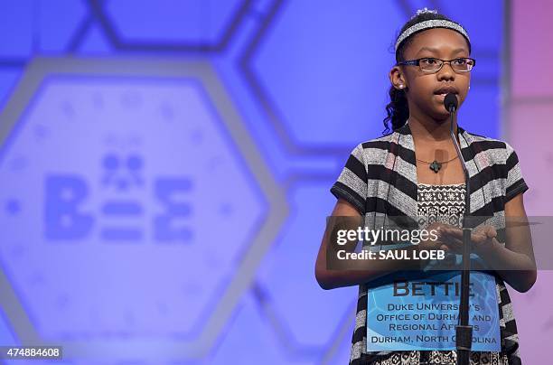 Bettie Closs of North Carolina, spells her word, "osteomalacia," during the 3rd round of the 88th Annual Scripps National Spelling Bee at National...