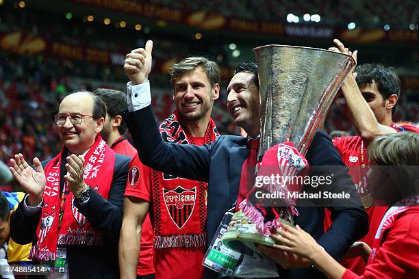 Unai Emery, coach of Sevilla celebrates victory with Sevilla President Jose Castro and the trophy after the UEFA Europa League Final match between FC...