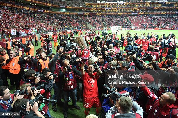 Aleix Vidal of Sevilla lifts the trophy as he celebrates victory after the UEFA Europa League Final match between FC Dnipro Dnipropetrovsk and FC...