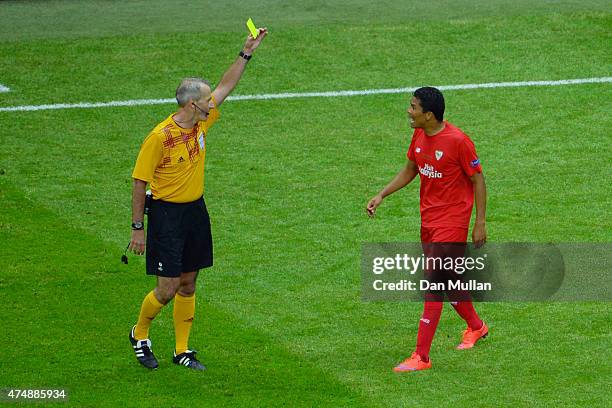 Carlos Bacca of Sevilla is shown a yellow card by referee Martin Atkinson during the UEFA Europa League Final match between FC Dnipro Dnipropetrovsk...