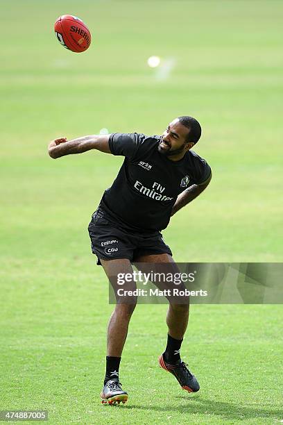 Heritier Lumumba marks the ball during a Collingwood Magpies AFL training session at the Southport Football Club on February 26, 2014 on the Gold...