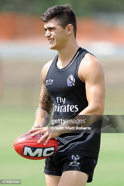 Marley Williams looks on during a Collingwood Magpies AFL training session at the Southport Football Club on February 26, 2014 on the Gold Coast,...