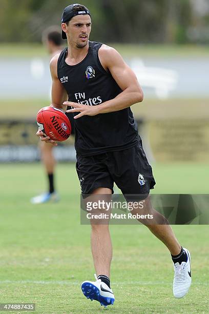Scott Pendlebury looks to kick the ball during a Collingwood Magpies AFL training session at the Southport Football Club on February 26, 2014 on the...