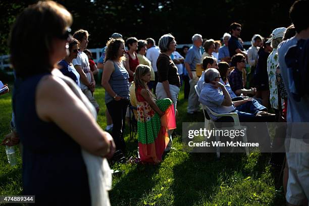 Supporters listen as Democratic presidential candidate and U.S. Sen. Bernie Sanders speaks to supporters at a house party campaign event at the home...