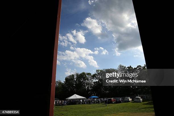 Democratic presidential candidate and U.S. Sen. Bernie Sanders speaks to supporters under a tent at a house party campaign event at the home of...