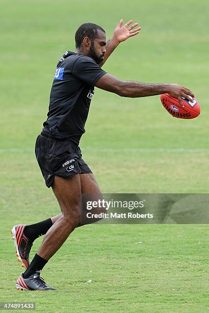 Heritier Lumumba kicks the ball during a Collingwood Magpies AFL training session at the Southport Football Club on February 26, 2014 on the Gold...