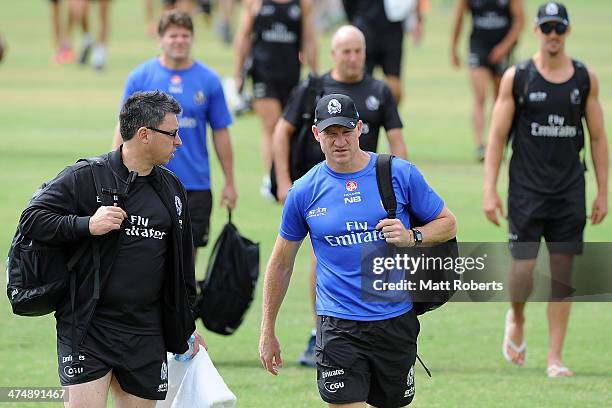 Magpies coach Nathan Buckley arrives with his team during a Collingwood Magpies AFL training session at the Southport Football Club on February 26,...