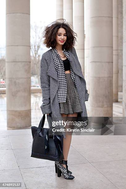 Fashion Blogger Lena Mahfouf wears a Front Row skirt, Marc Jacobs bag, Forever 21 shoes, vintage coat and jacket on day 1 of Paris Collections: Women...