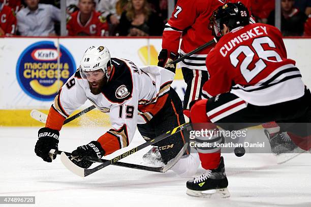 Patrick Maroon of the Anaheim Ducks tries to control the puck as Kyle Cumiskey of the Chicago Blackhawks defends in the first period of Game Six of...