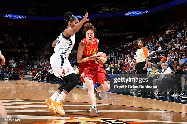 Wu Di of the Chinese Women's Olympic Team drives against the Connecticut Sun on May 27, 2015 at Mohegan Sun in Uncasville, Connecticut. NOTE TO USER:...