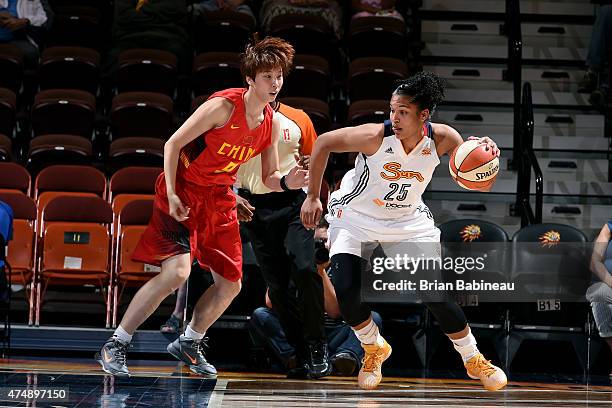 Alyssa Thomas of the Connecticut Sun handles the ball against Wu Di of the Chinese Women's Olympic Team on May 27, 2015 at Mohegan Sun in Uncasville,...