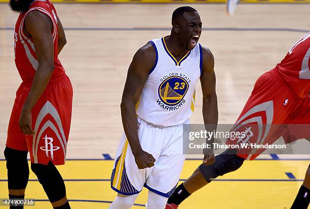 Draymond Green of the Golden State Warriors reacts after making a basket in the first quarter against the Houston Rockets during game five of the...