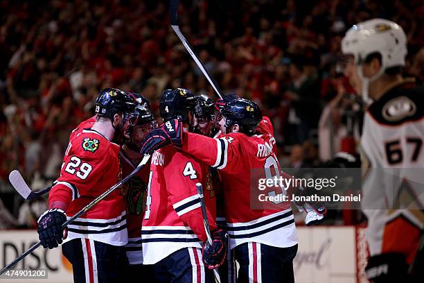 Marian Hossa of the Chicago Blackhawks celebrates with teammates after scoring a second period goal against the Anaheim Ducks in Game Six of the...