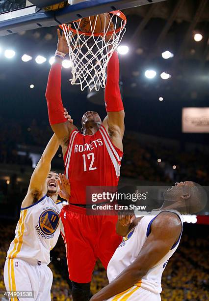 Dwight Howard of the Houston Rockets dunks the ball in front of Klay Thompson of the Golden State Warriors in the first half during game five of the...