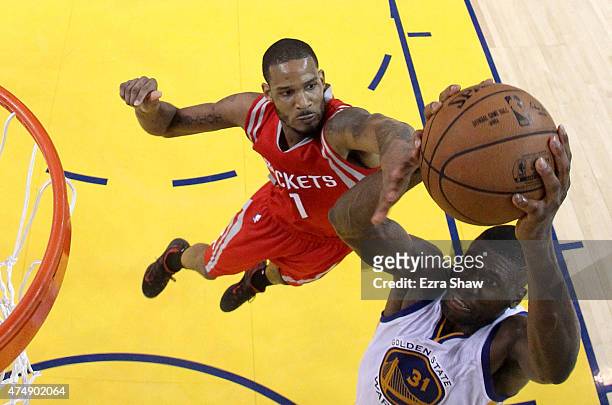 Festus Ezeli of the Golden State Warriors goes up for a dunk against Trevor Ariza of the Houston Rockets in the first half during game five of the...