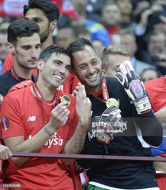 Members of Sevilla celebrate their victory as they won UEFA Europa League trophy after the UEFA Europa League Final match between FC Dnipro...